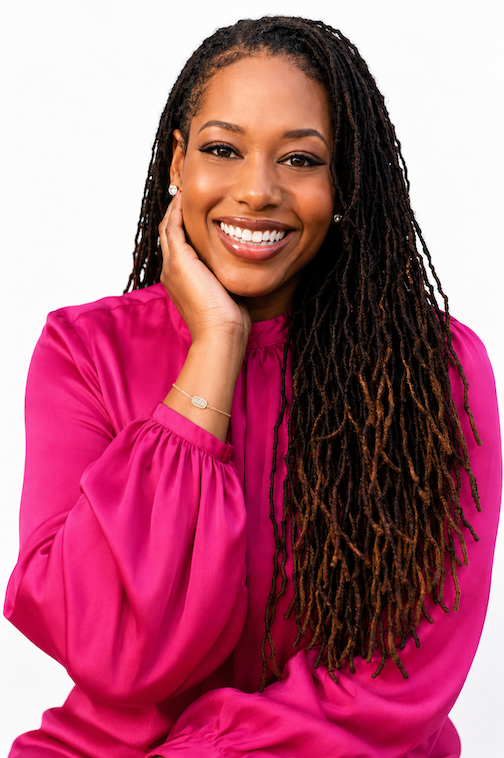 Dr. Hope King smiling with her hand resting against her cheek